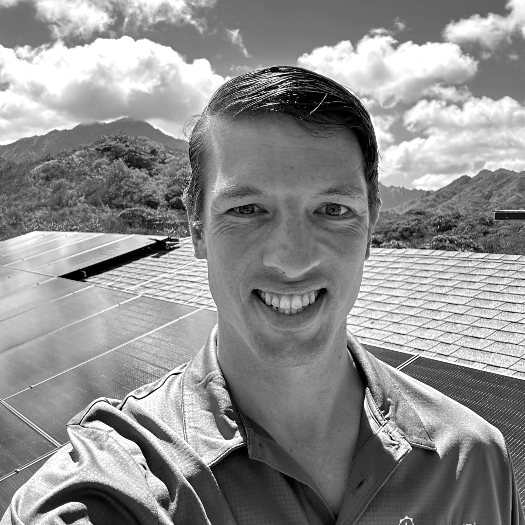 Luke Pye, Founder of PYE Energy Group, on a rooftop solar installation in Hawaii